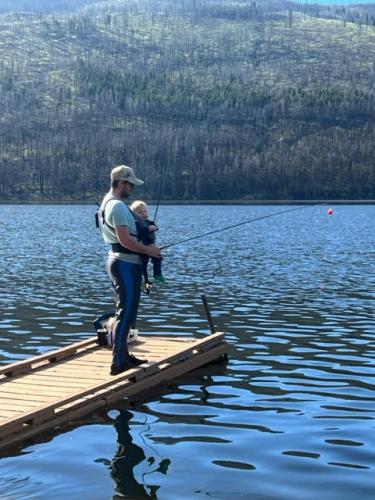 Man with baby fishing